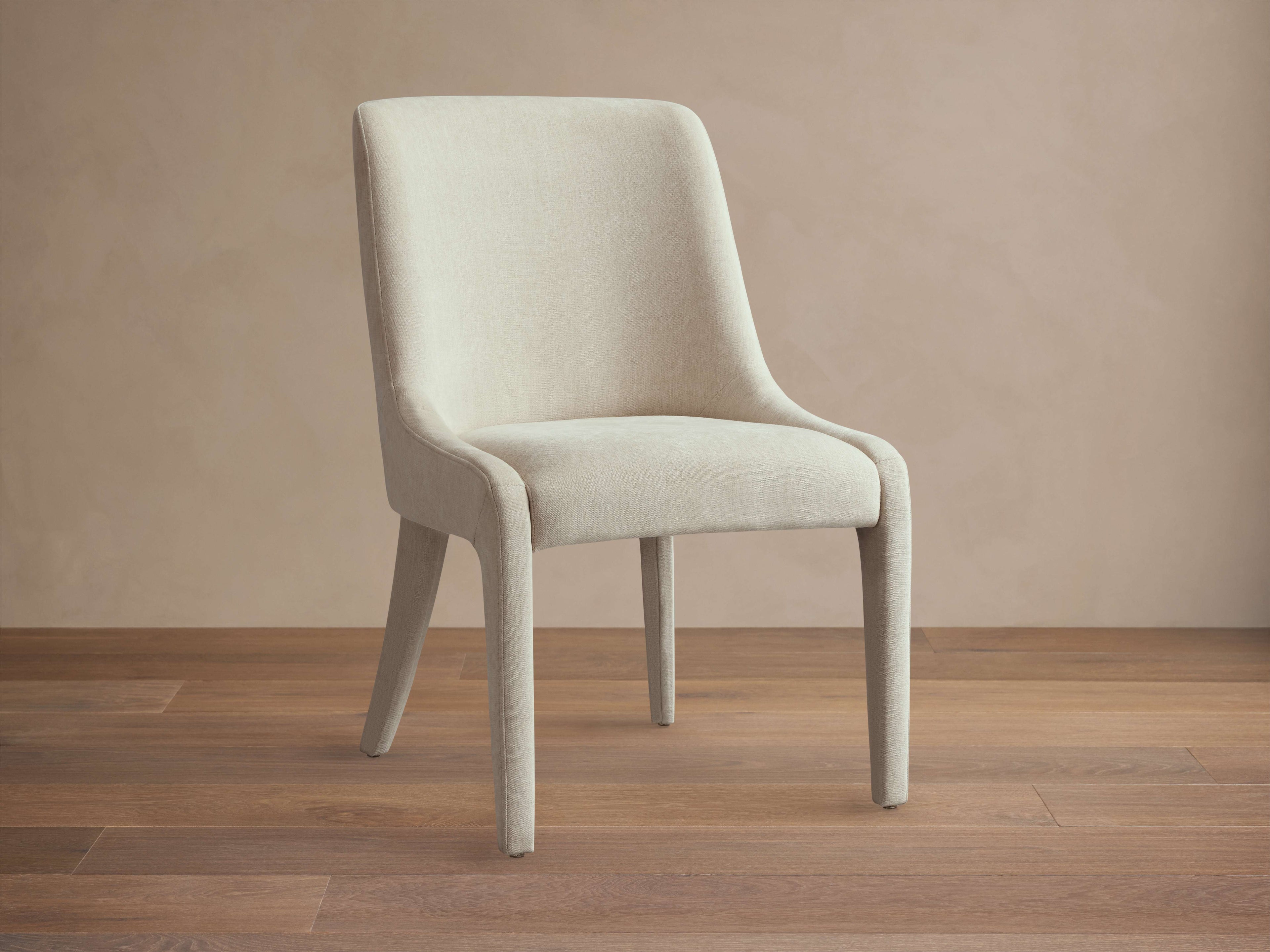 Chaise de salle à manger entièrement tapissée avec dossier arrondi