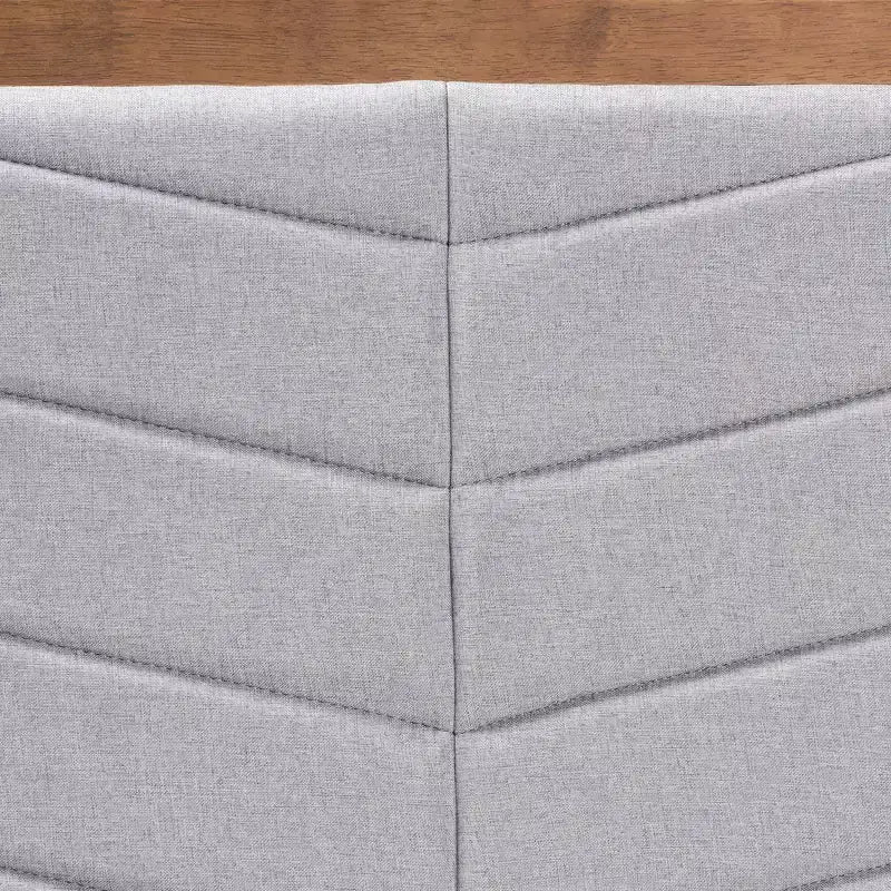 Tête de lit en bois tapissée de tissu